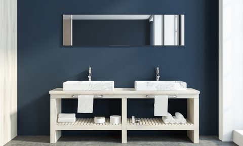 Dark blue contemporary bathroom with white double sinks
