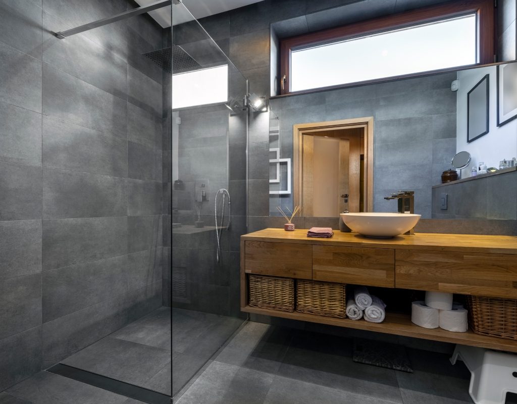 modern bathroom with dark grey tiled shower