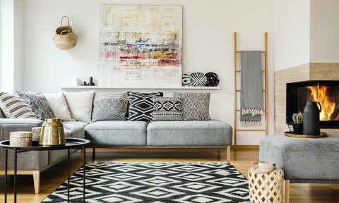 how to decorate a living room with fireplace in the middle patterned carpet decorative interior painting above