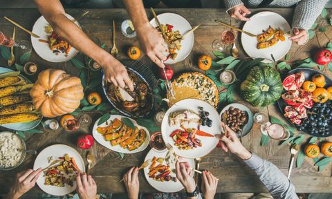 tips for hosting friendsgiving table setting hands