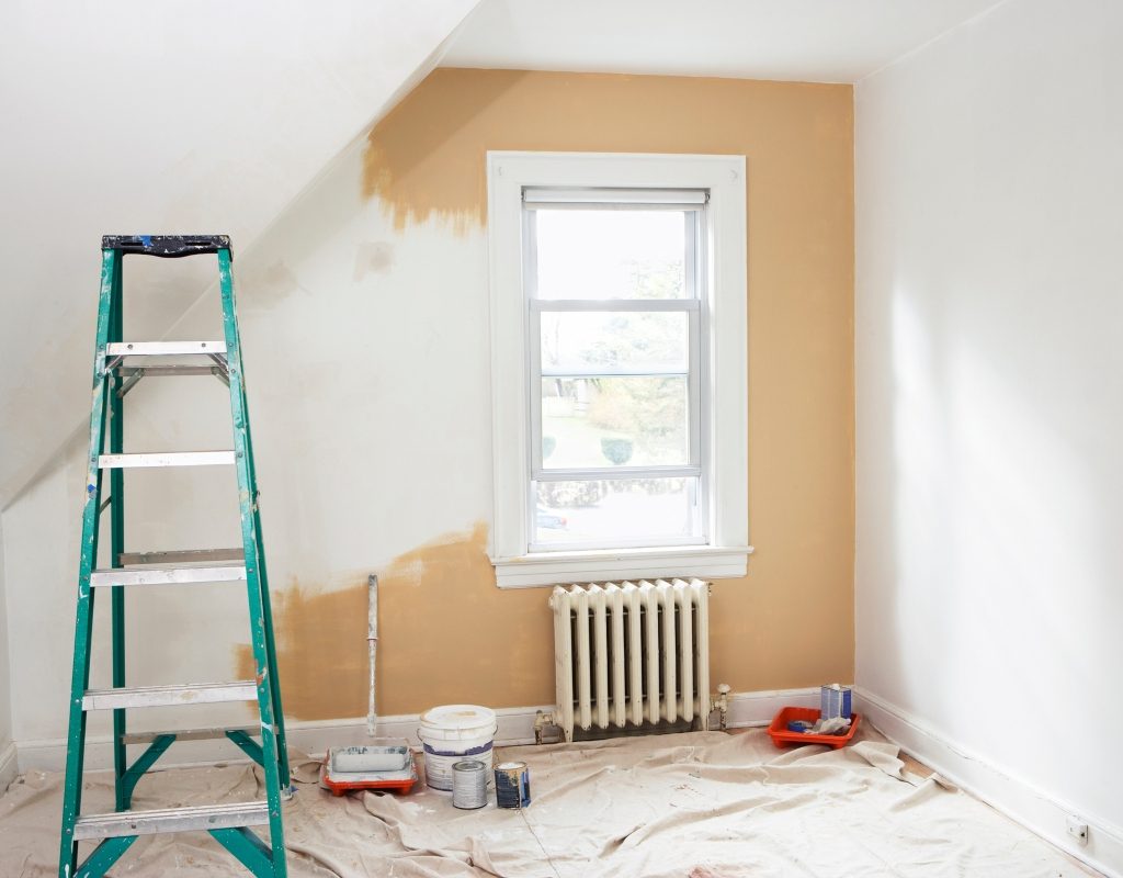 bedroom renovation with ladder and paint