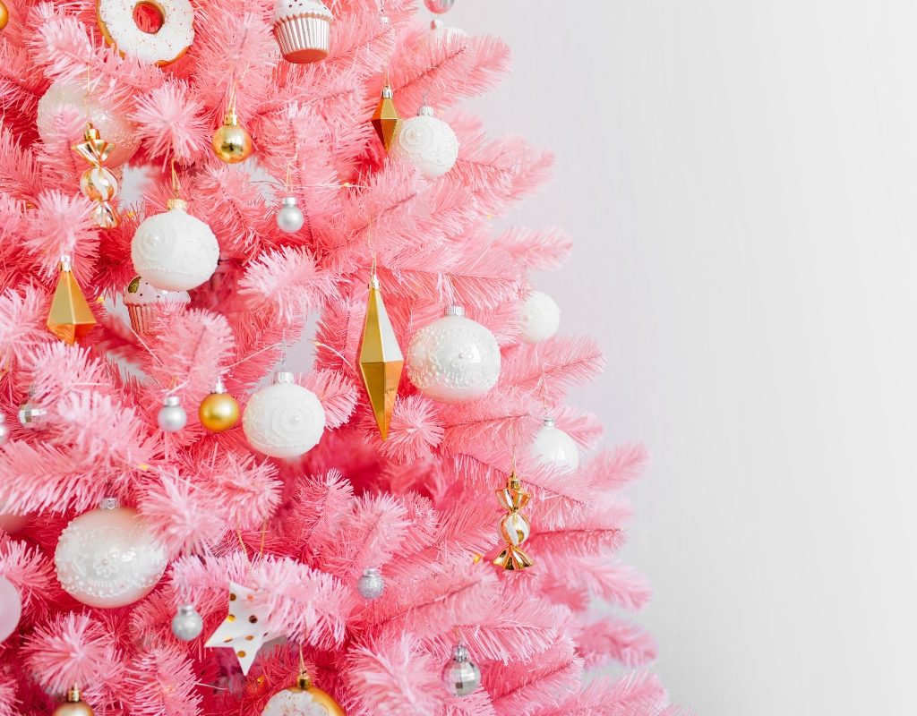 pink christmas tree with gold ornaments