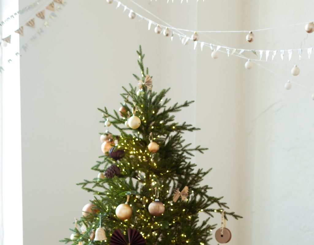 minimal christmas tree with neutral colored ornaments