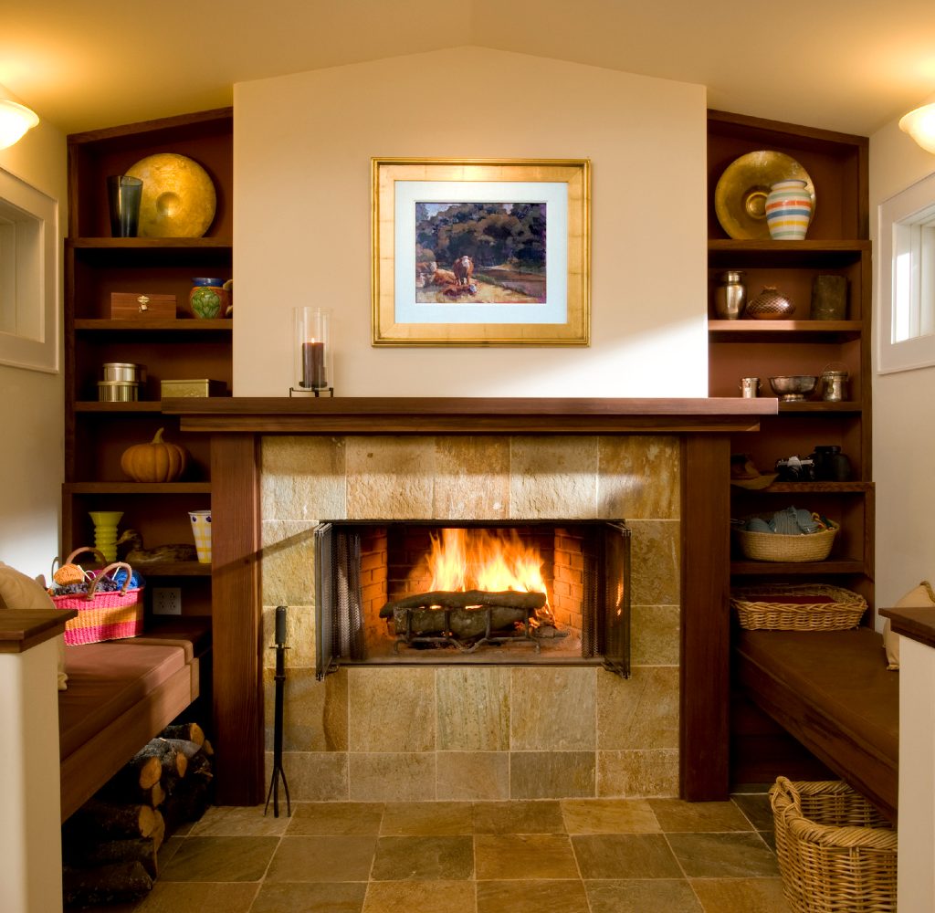 Decluttered mantle with art and candle.