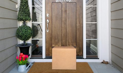 package sitting on front porch by door