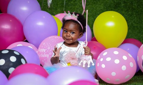 child with balloons