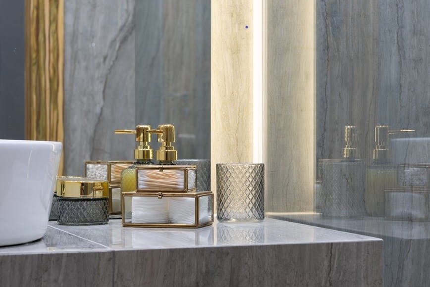 bathroom with marble sink and walls