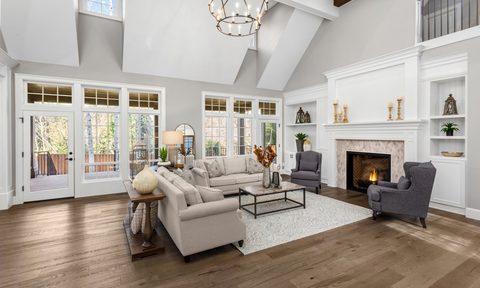 Luxurious neutral and white living space open concept with chandelier