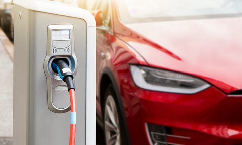 can teslas raise property values charging station on the background of an electric car
