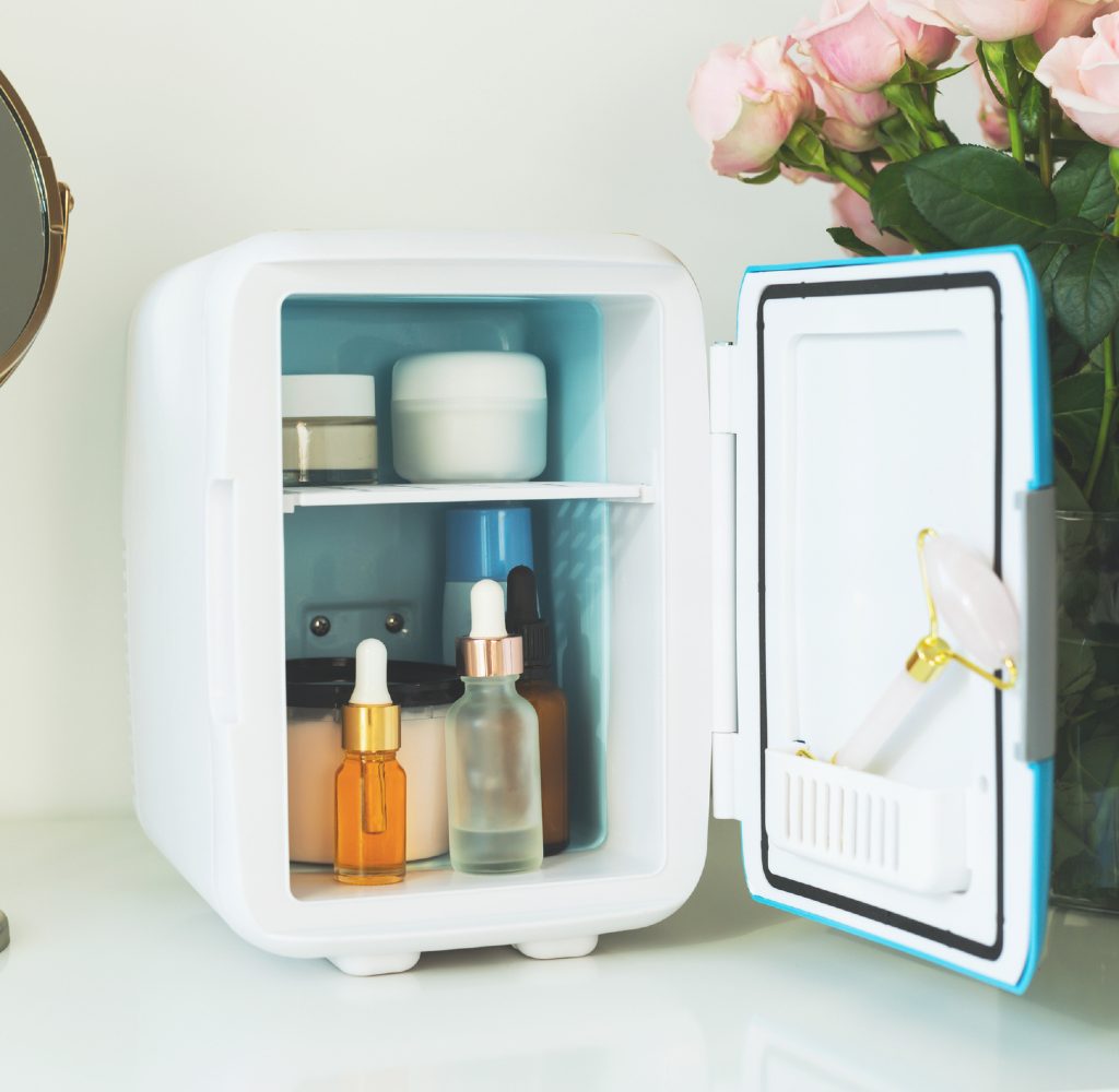 Mini fridge with skincare products inside.