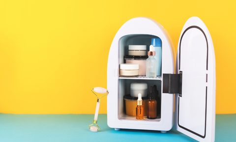 Mini fridge with skincare products inside.