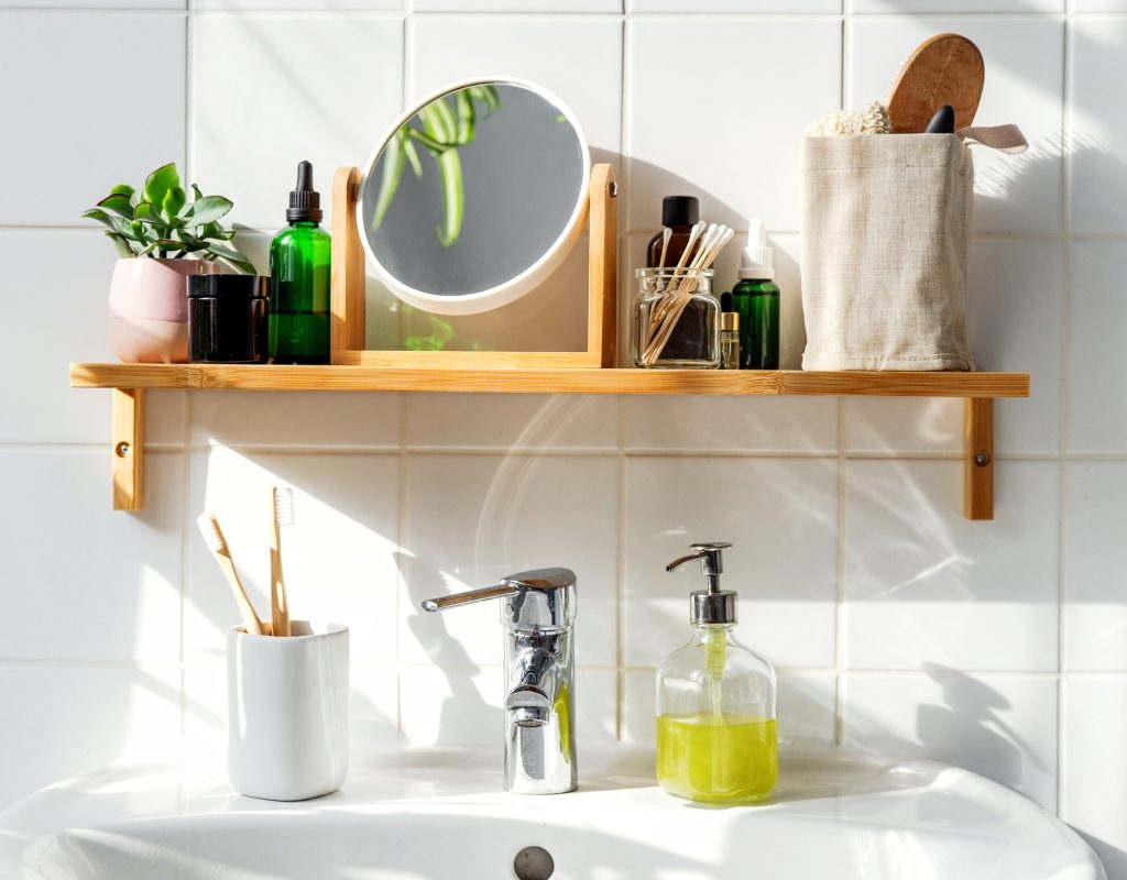 small bathroom wood shelf with minimal decor above sink