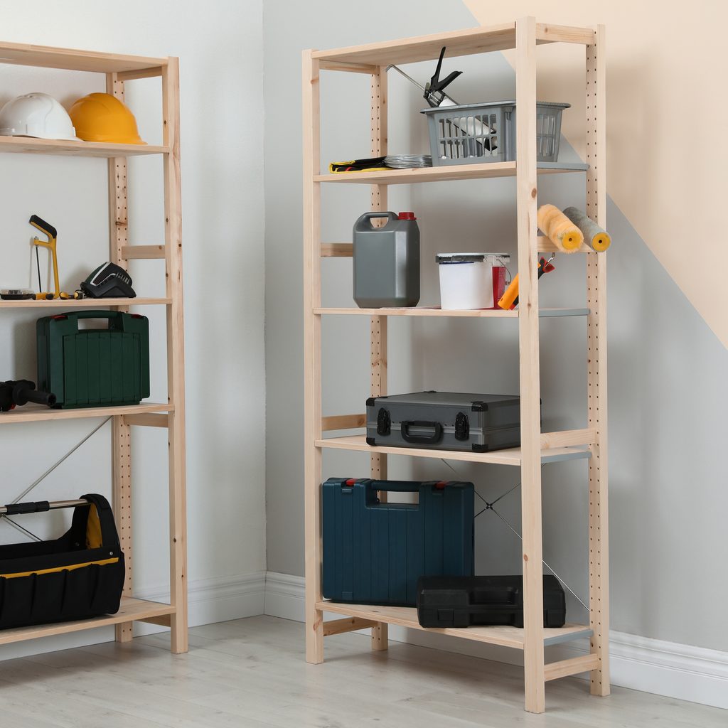 Storage shelves in a corner against white walls