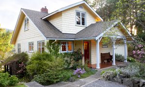Exterior of light yellow house.