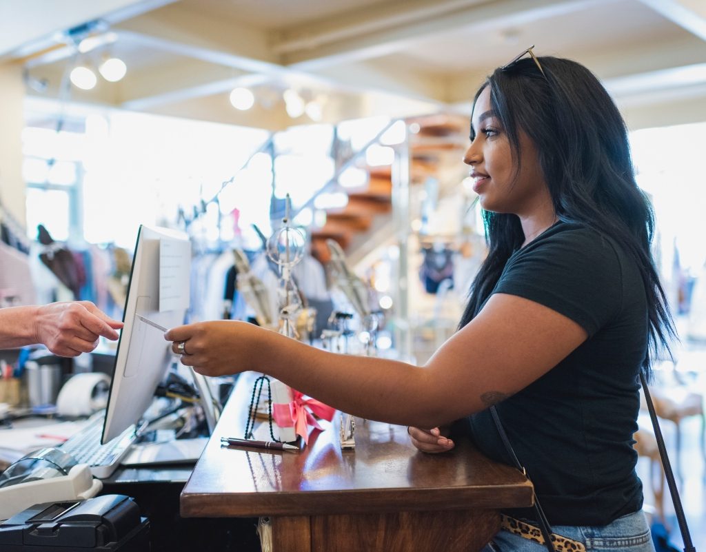 woman shopping in store with a credit card