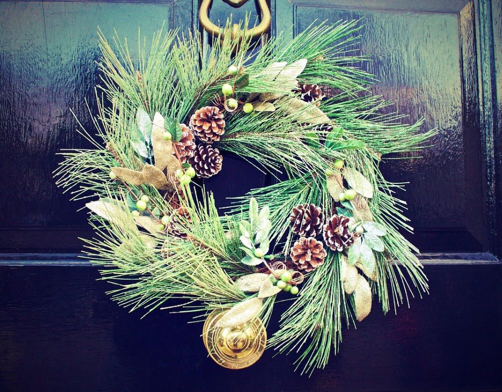 holiday wreath on a black door