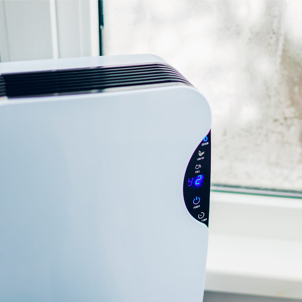 Dehumidifier by a window