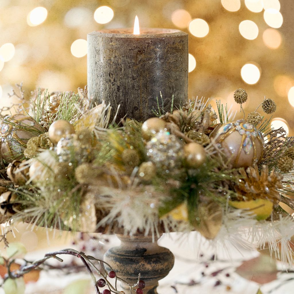 Christmas centerpiece wreath wrapped around a candle
