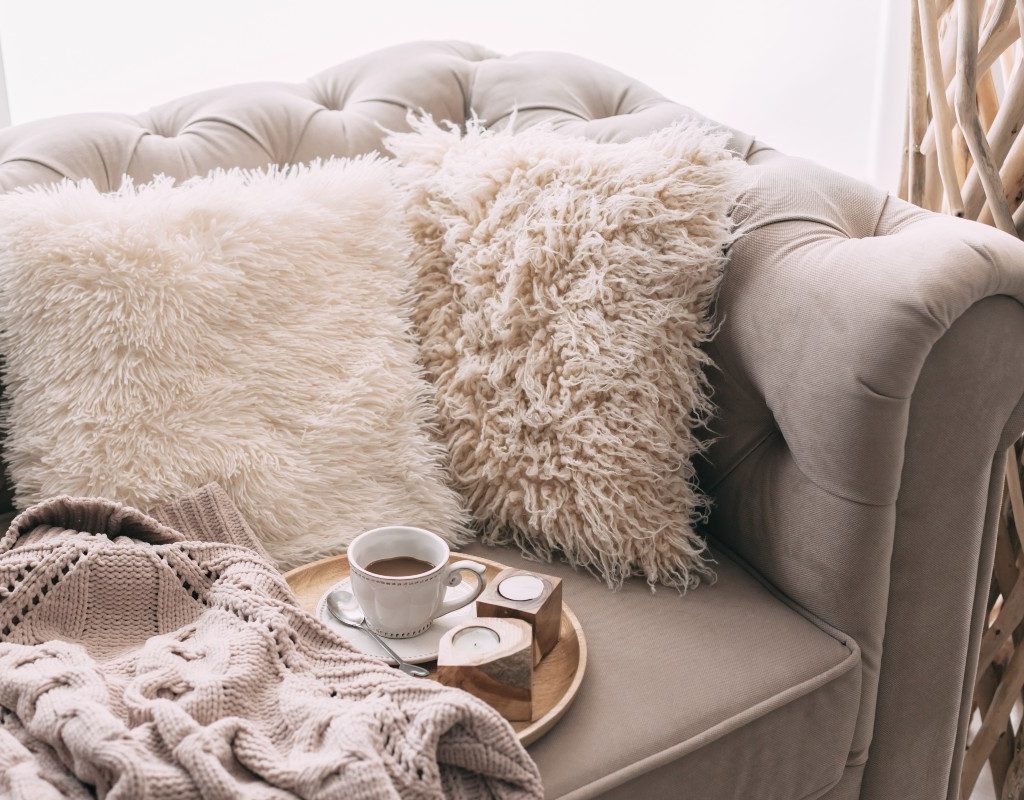 Cozy couch with light-colors and faux fur texture