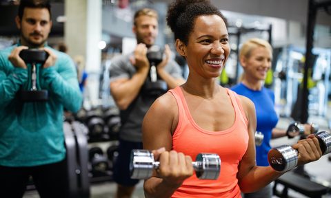 home fitness or gym group of young friends people doing exercises in