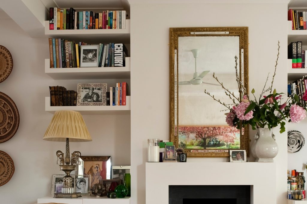Mirror and flowers on mantel for vintage design