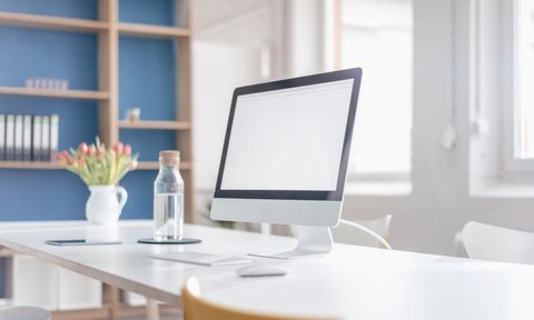 modern home office desk with computer and usb cords
