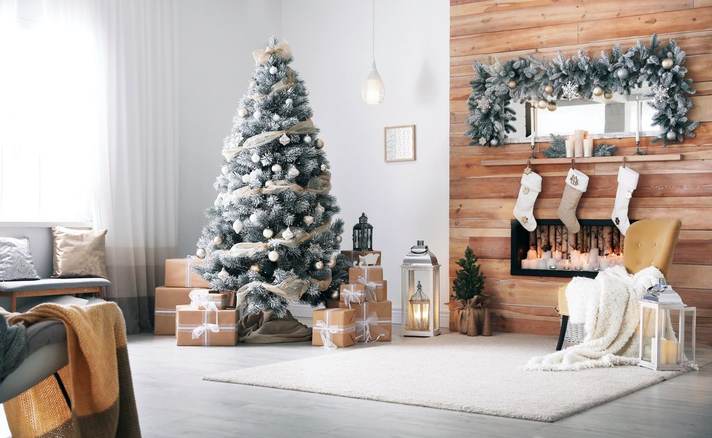 Festive interior with decorated Christmas tree and fireplace