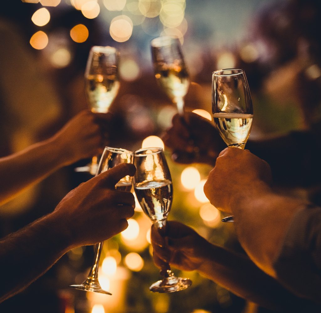 People toasting champagne on New Year's Eve.