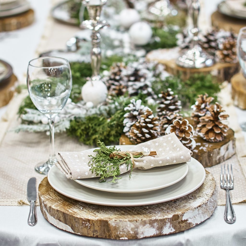 Table set with pine cones and pine branches