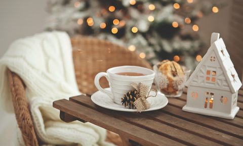 Wood table with a white ceramic mug for Christmas