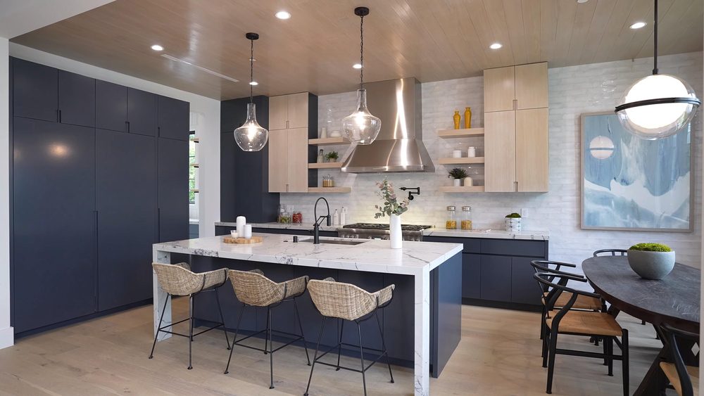 Blue and white kitchen with modern lighting