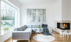 White sitting room interior with gray corner sofa