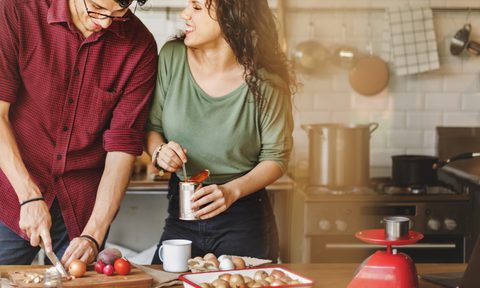 couple cooking in efficient kitchen