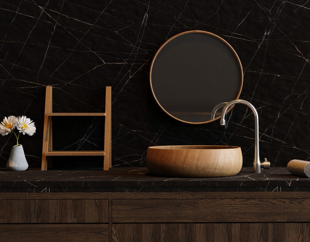 Dark black bathroom wall color with natural decor