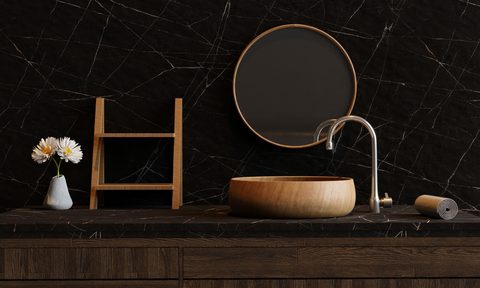 Dark black bathroom wall color with natural decor