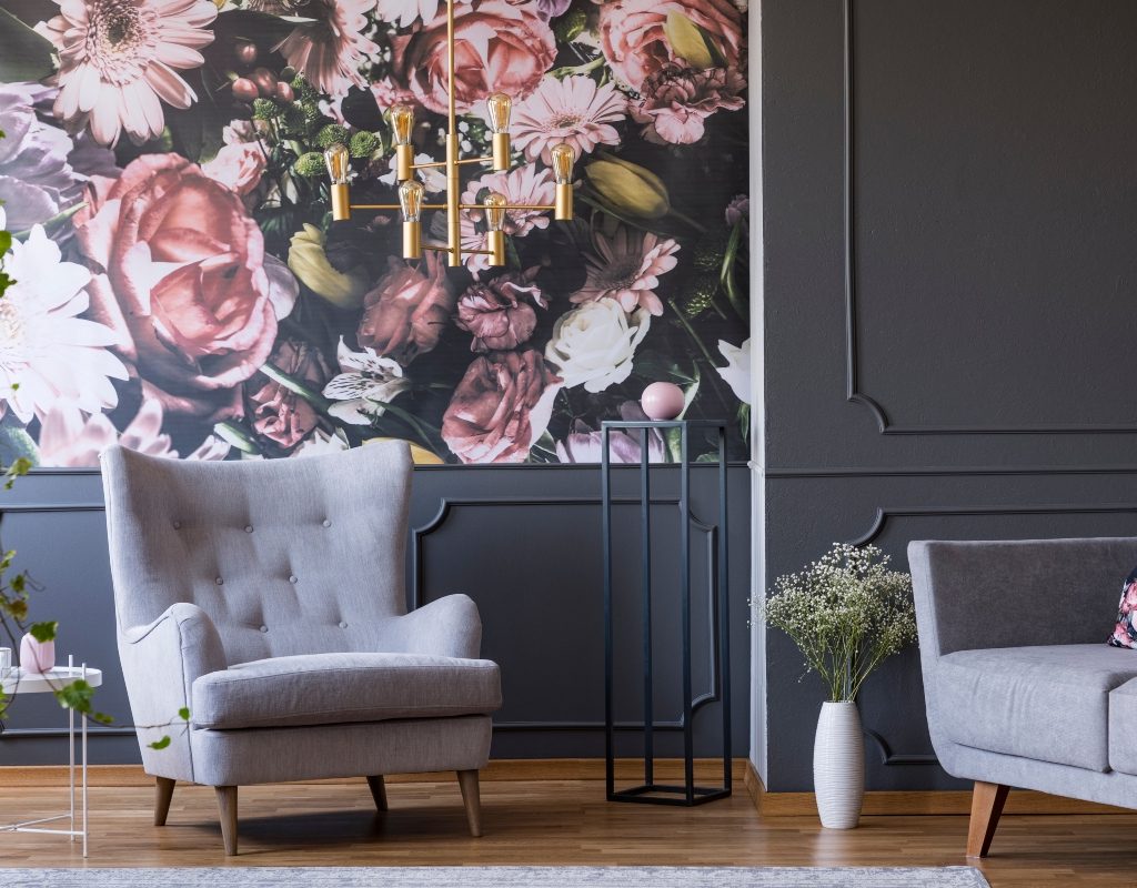Vintage floral wallpaper with a gray chair