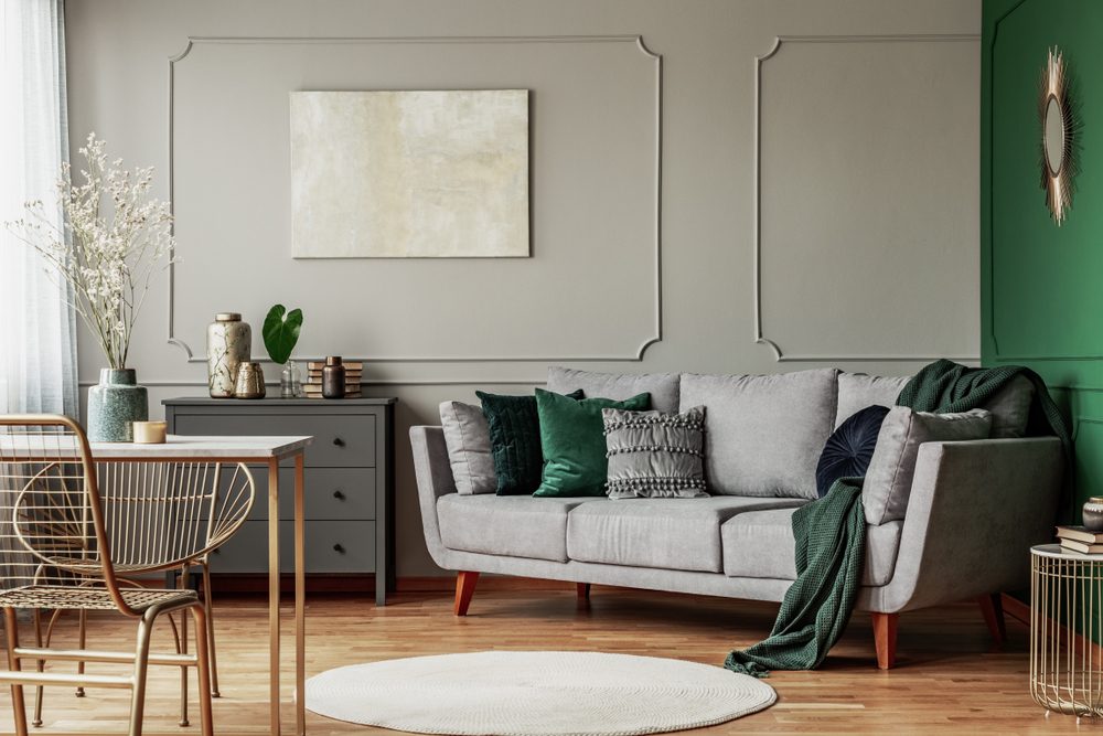 living room with gray and green color palette