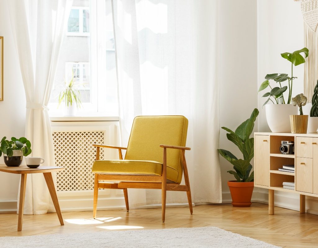 Midcentury modern yellow chair and side table