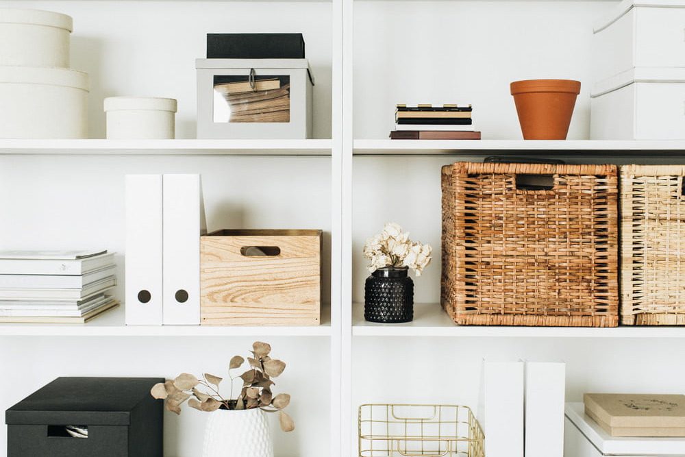 Entryway with shelves and storage bin.