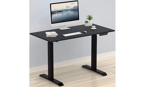 SHW Memory Preset Electric Height Adjustable Standing Desk placed against a wall.