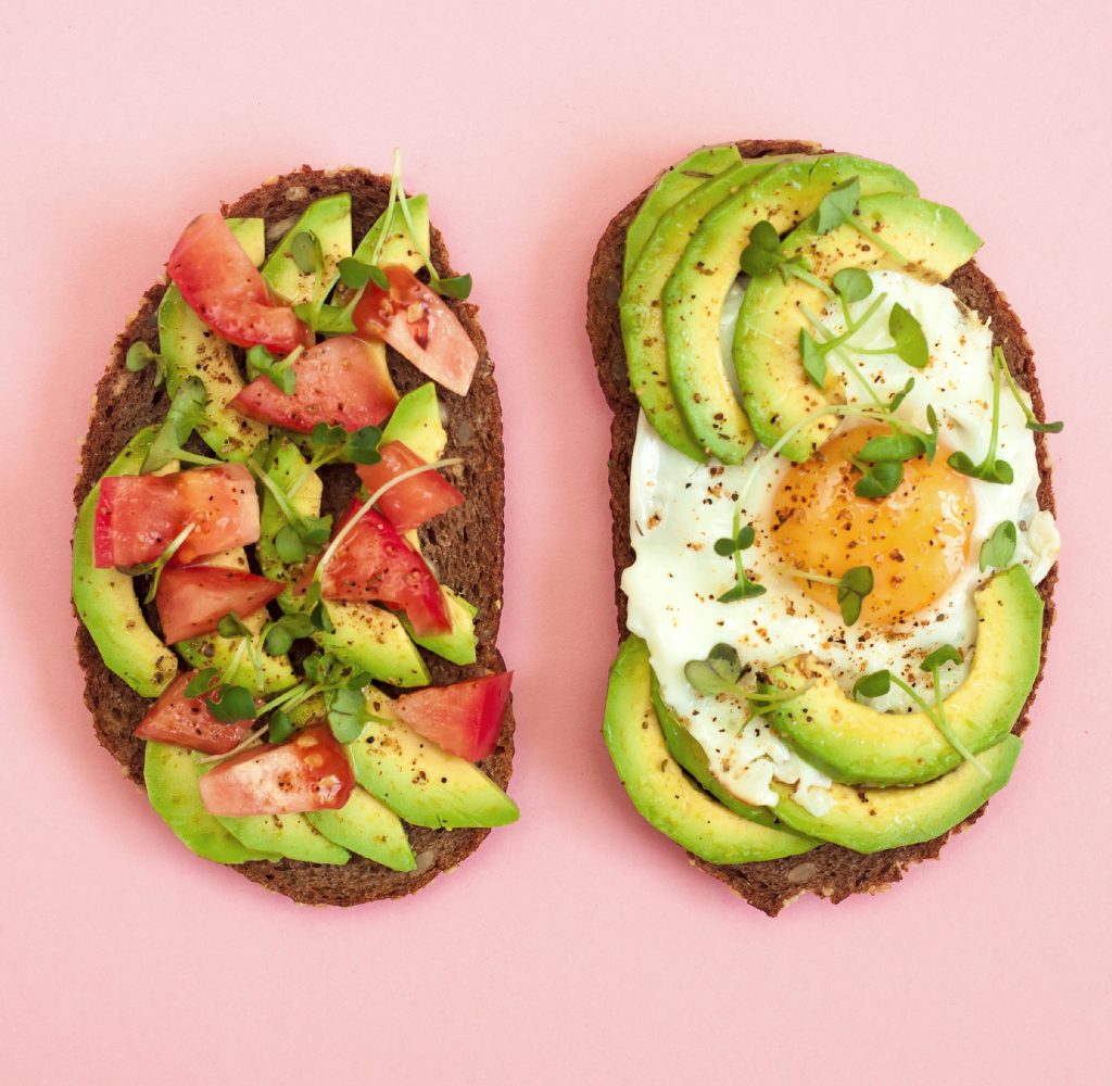 Avacado egg toast with tomatoes.