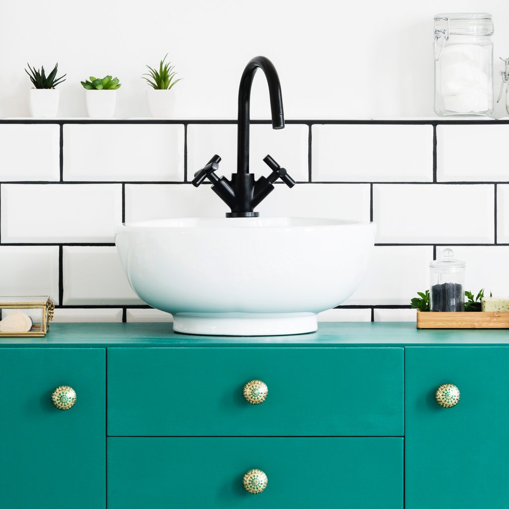 Bathroom with green vanity