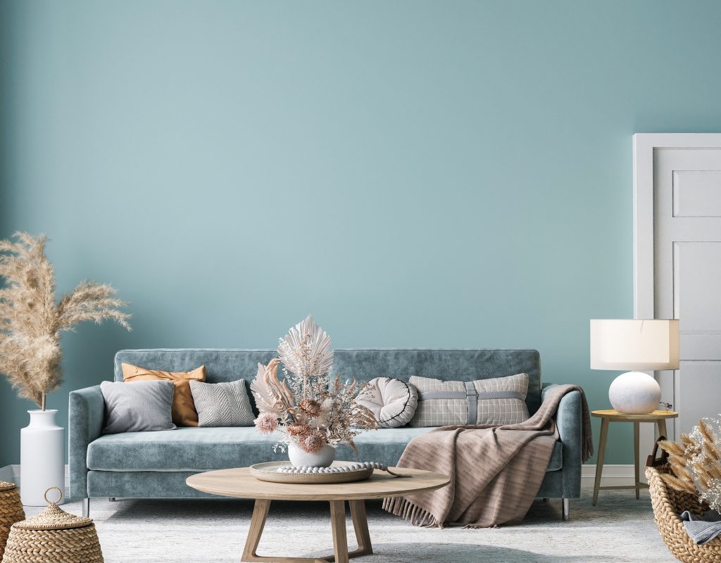 Blue living room with a slate blue sofa in a bohemian style