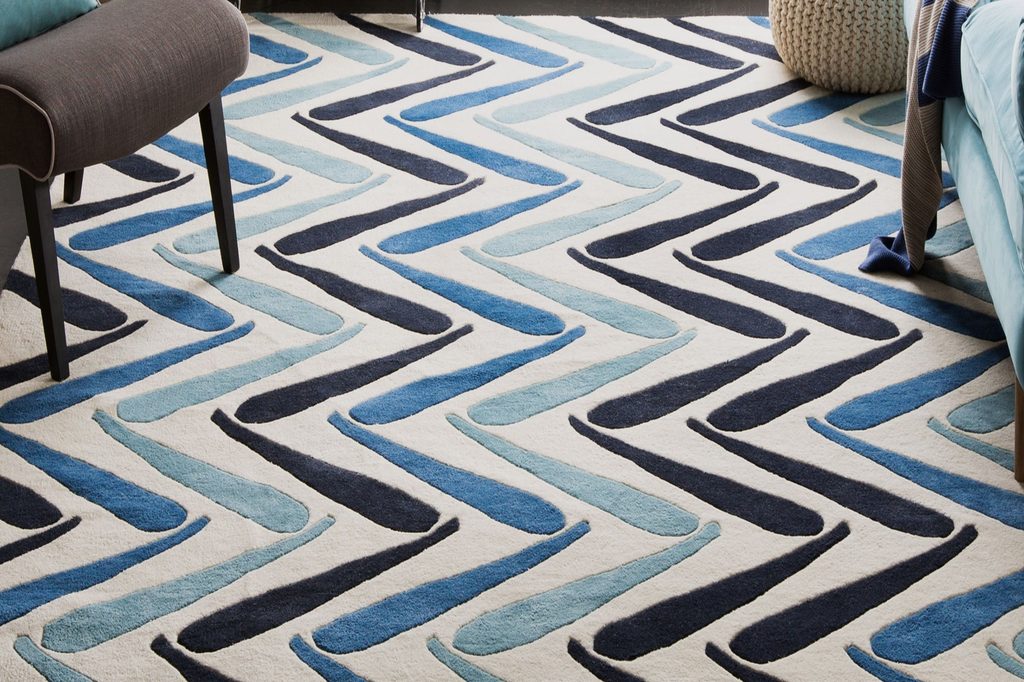 blue patterned rug on floor