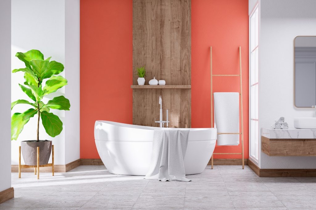 Bold peach accent color in a modern bathroom