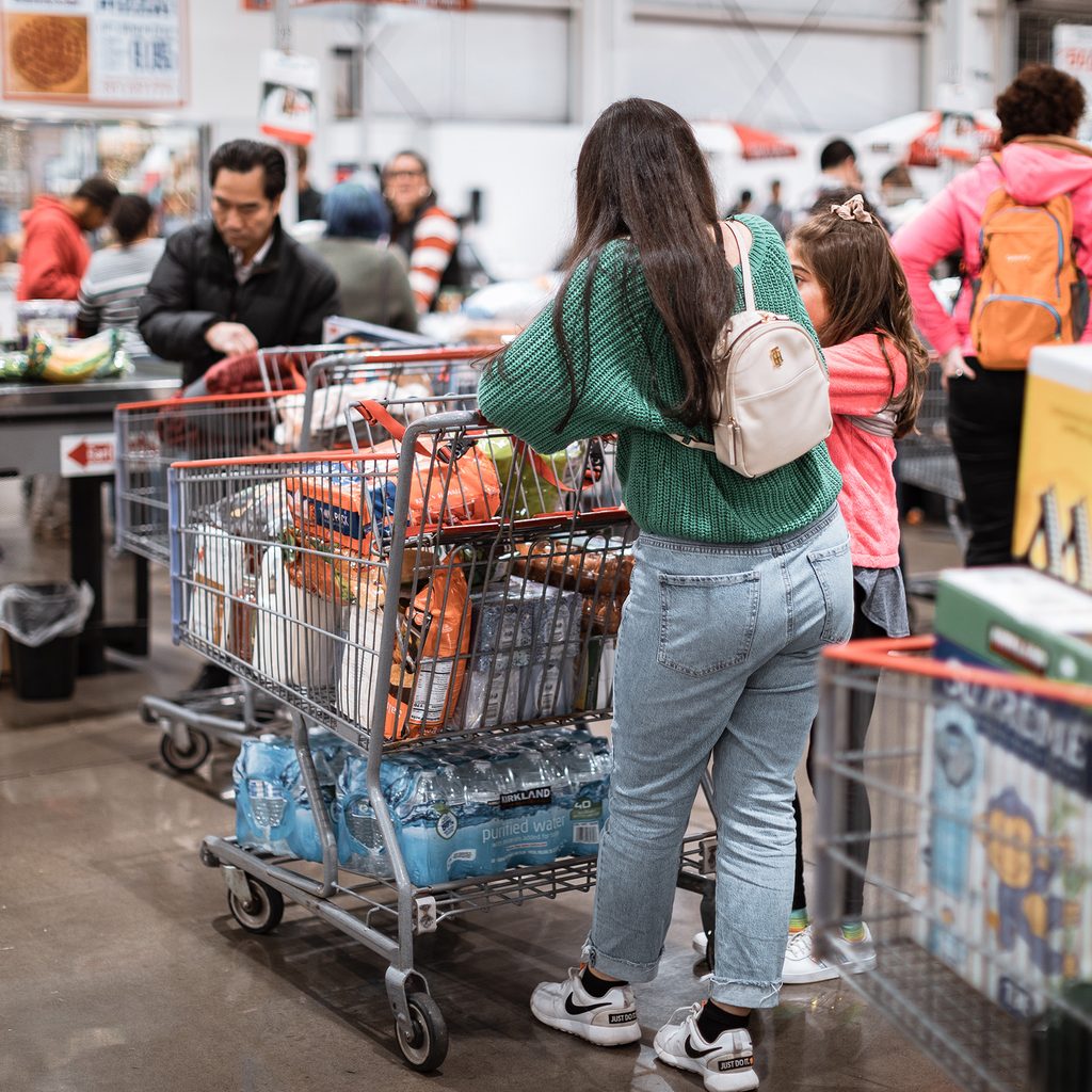 Crowded checkout line at a warehouse grocery store
