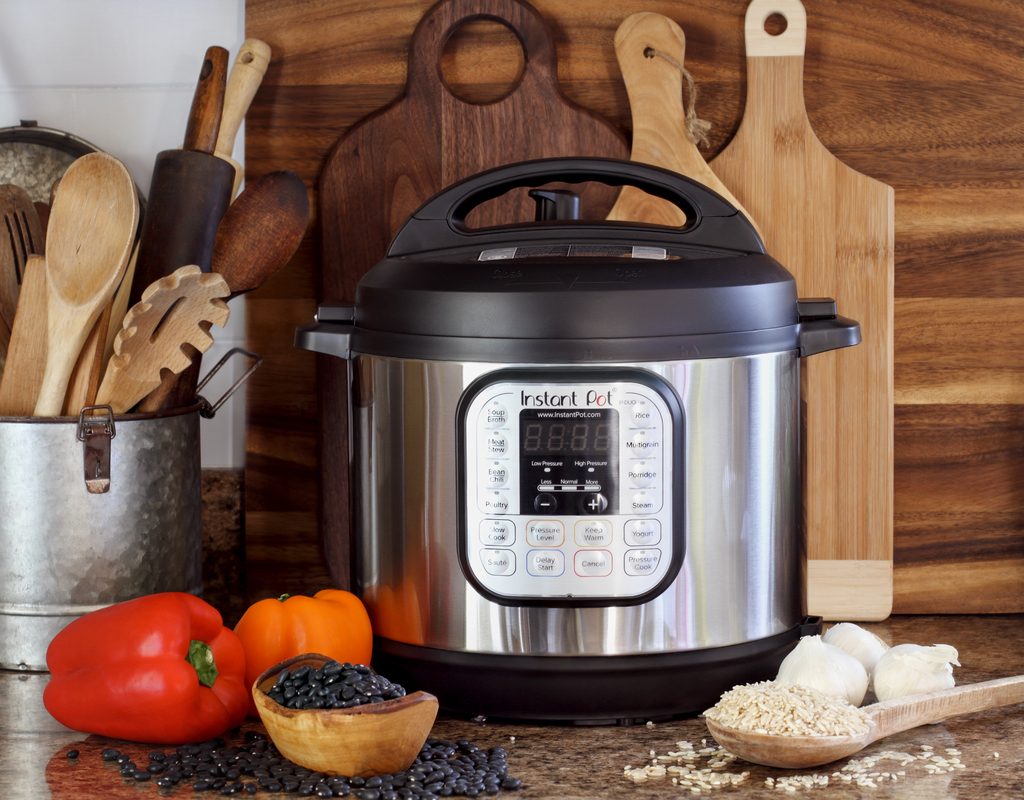 Instant Pot pressure cooker with ingredients on the kitchen counter