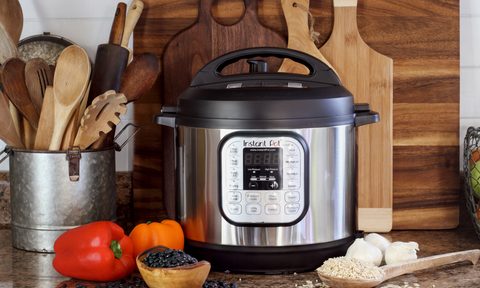 Instant Pot pressure cooker with ingredients on the kitchen counter
