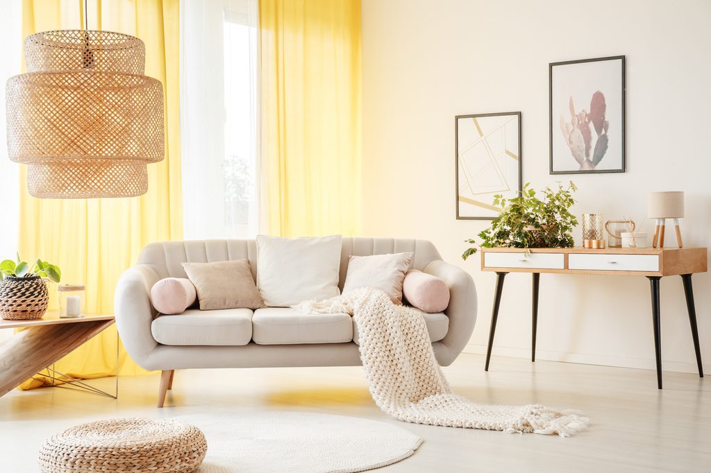 Living room with warm, butter yellow curtains