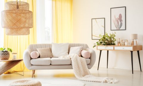 Living room with warm, butter yellow curtains
